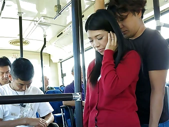 Black-haired Aimi Nagano gets her cock-squeezing crevice stretched in a bus ride